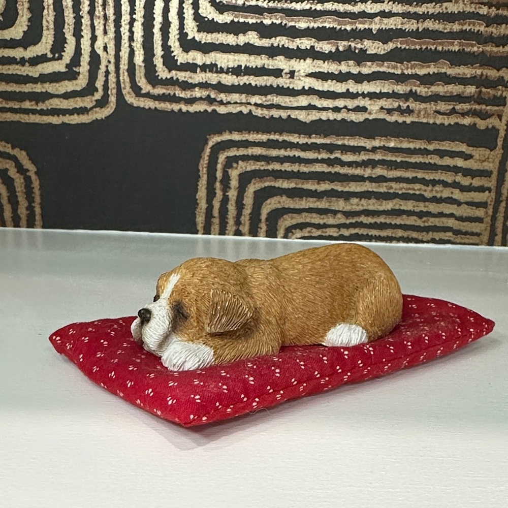 Adorable Canine Figurine on Red Cushion